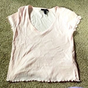 Baby pink shirt with ruffles at the bottom, size M